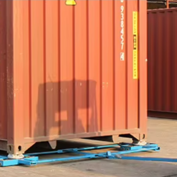 Container moving skates structural detail heavy‑load carrier device